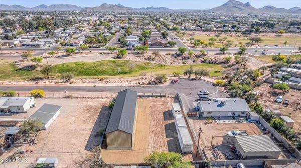 a view of backyard with wooden fence