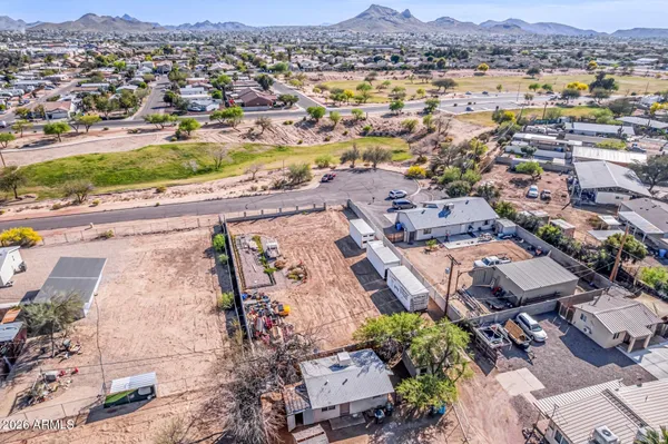 an aerial view of residential houses with outdoor space