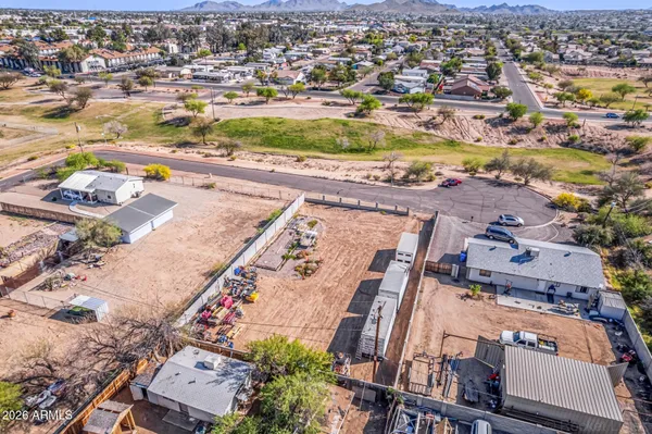 an aerial view of residential houses with outdoor space