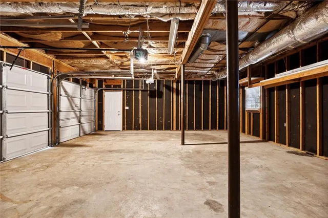 a balcony with wooden floor next to a yard