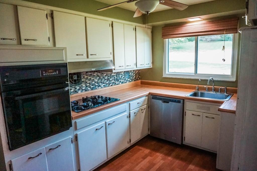 3211 Arapahoe Road Pittsburgh, PA 15241 - Photo 12 of 24 a kitchen with a sink stove and cabinets