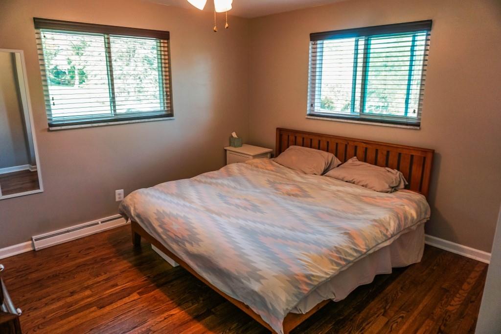 3211 Arapahoe Road Pittsburgh, PA 15241 - Photo 18 of 24 a large bed sitting in a bedroom next to a window