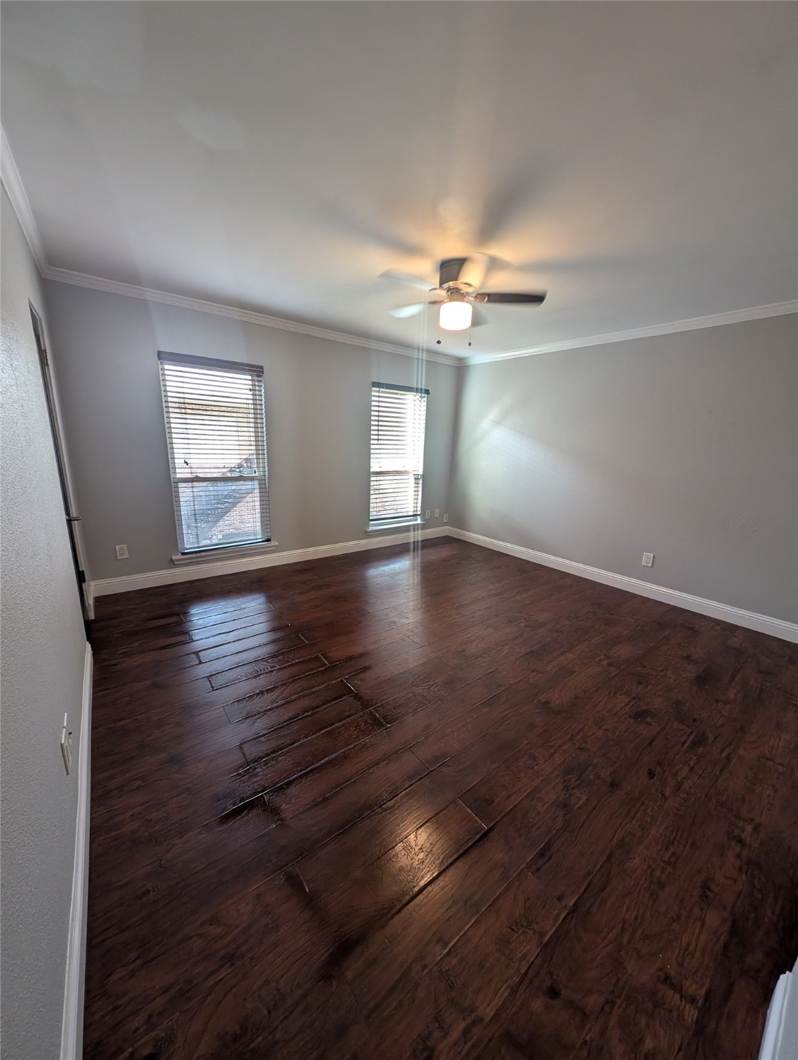2503 McCue Road, Unit 12 Houston, TX 77056 - Photo 11 of 22 an empty room with wooden floor chandelier fan and windows