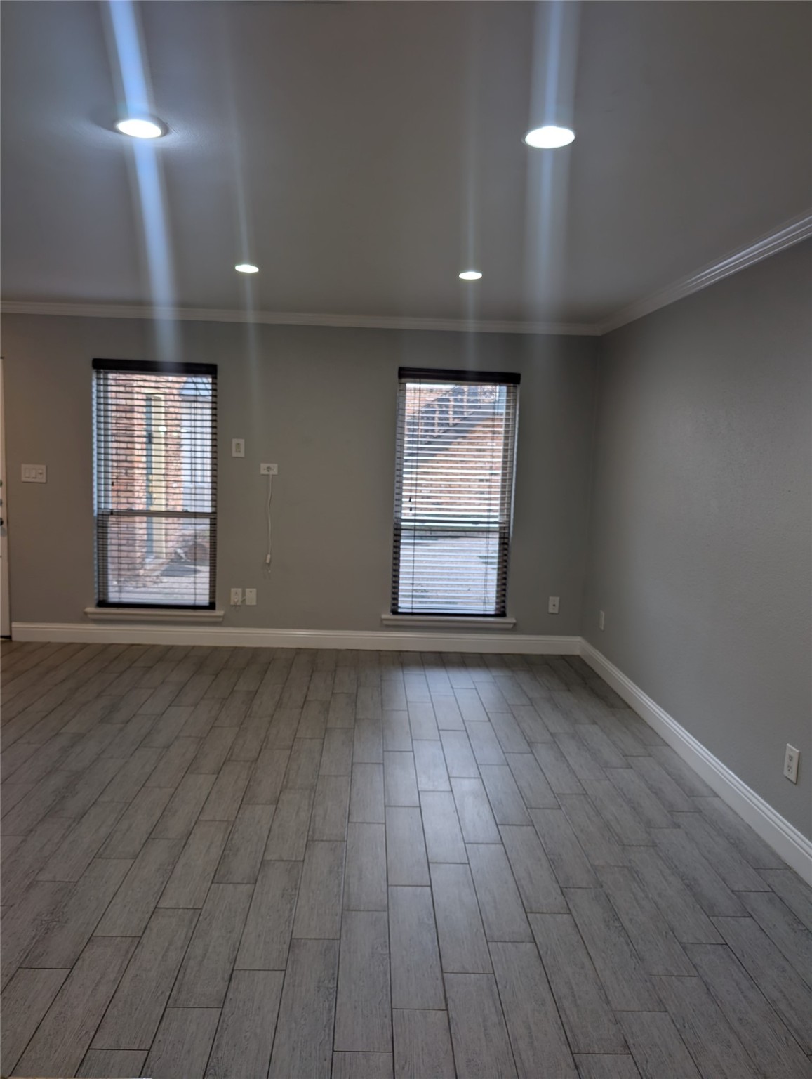 2503 McCue Road, Unit 12 Houston, TX 77056 - Photo 19 of 22 an empty room with wooden floor and windows