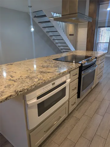 a view of kitchen with sink and stove