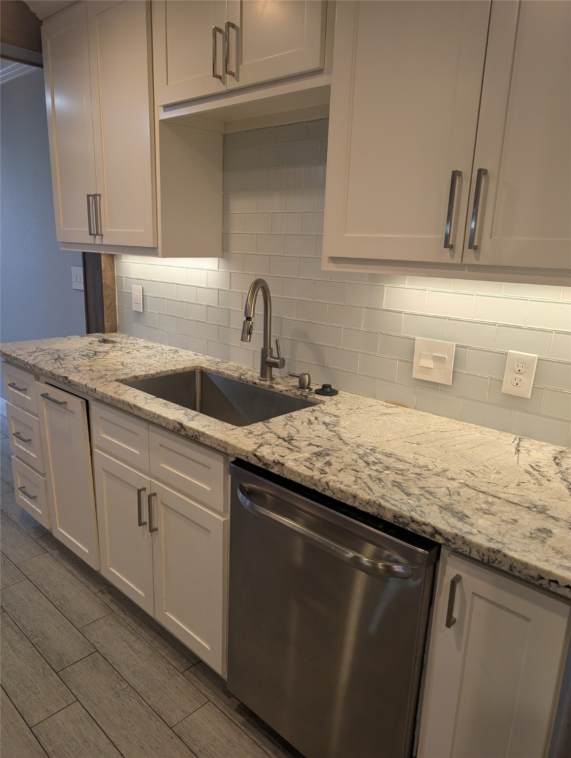 2503 McCue Road, Unit 12 Houston, TX 77056 - Photo 3 of 22 a kitchen with granite countertop a sink and cabinets