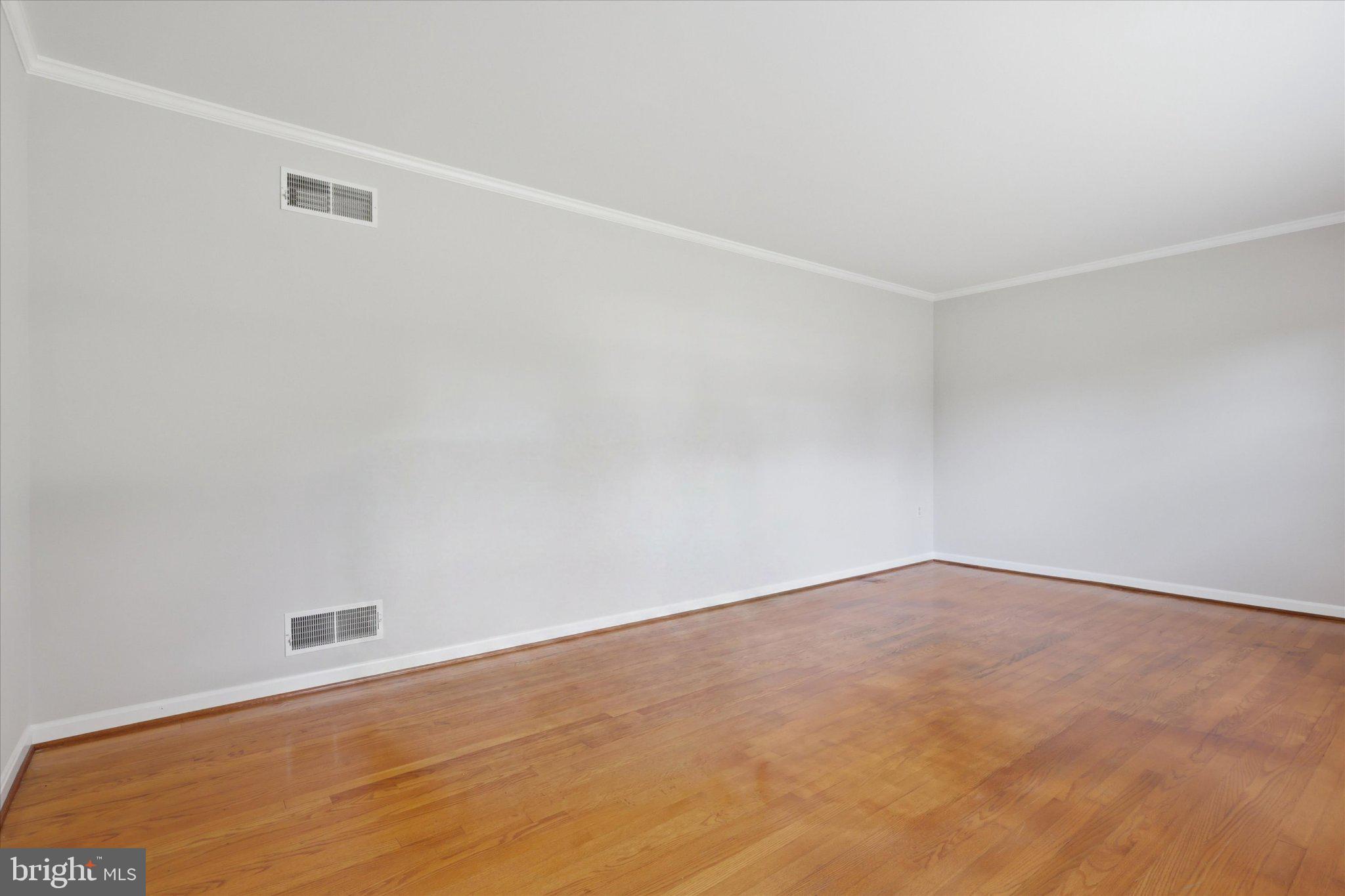 7007 Runnymeade Court Frederick, MD 21702 - Photo 6 of 37 Spacious room with warm wood floors.