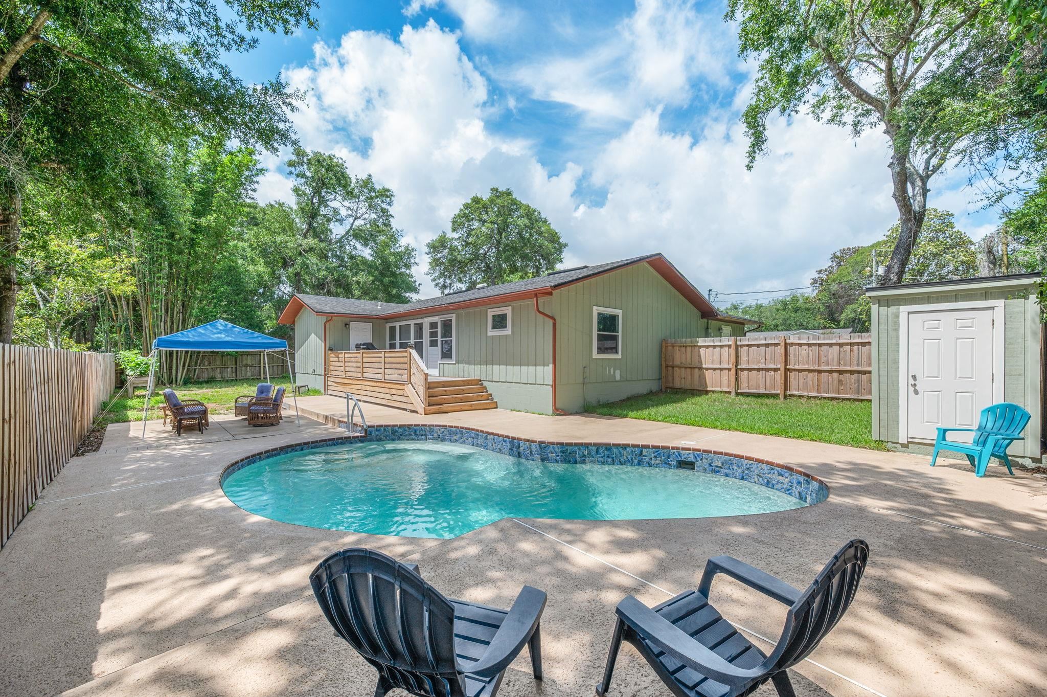 507 Gentian Road St. Augustine, FL 32086 - Photo 20 of 82 a view of a house with backyard and sitting area