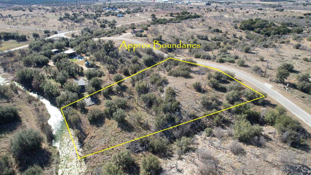 8045 Hells Gate Loop Strawn, TX 76475 - Photo 2 of 11 an aerial view of house with a mountain