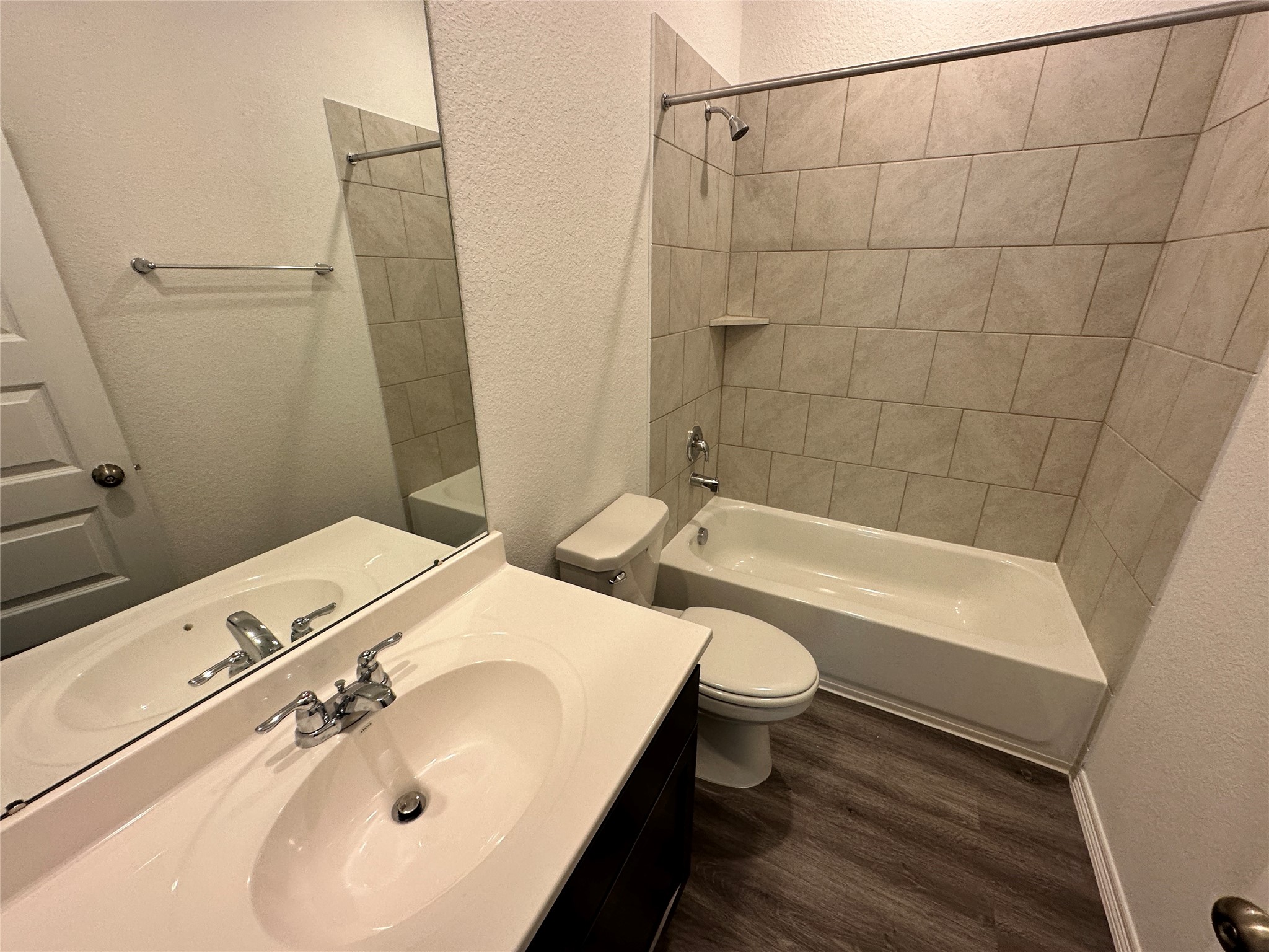 16504 Moss Lane Porter, TX 77365 - Photo 13 of 16 a bathroom with a sink a toilet and shower