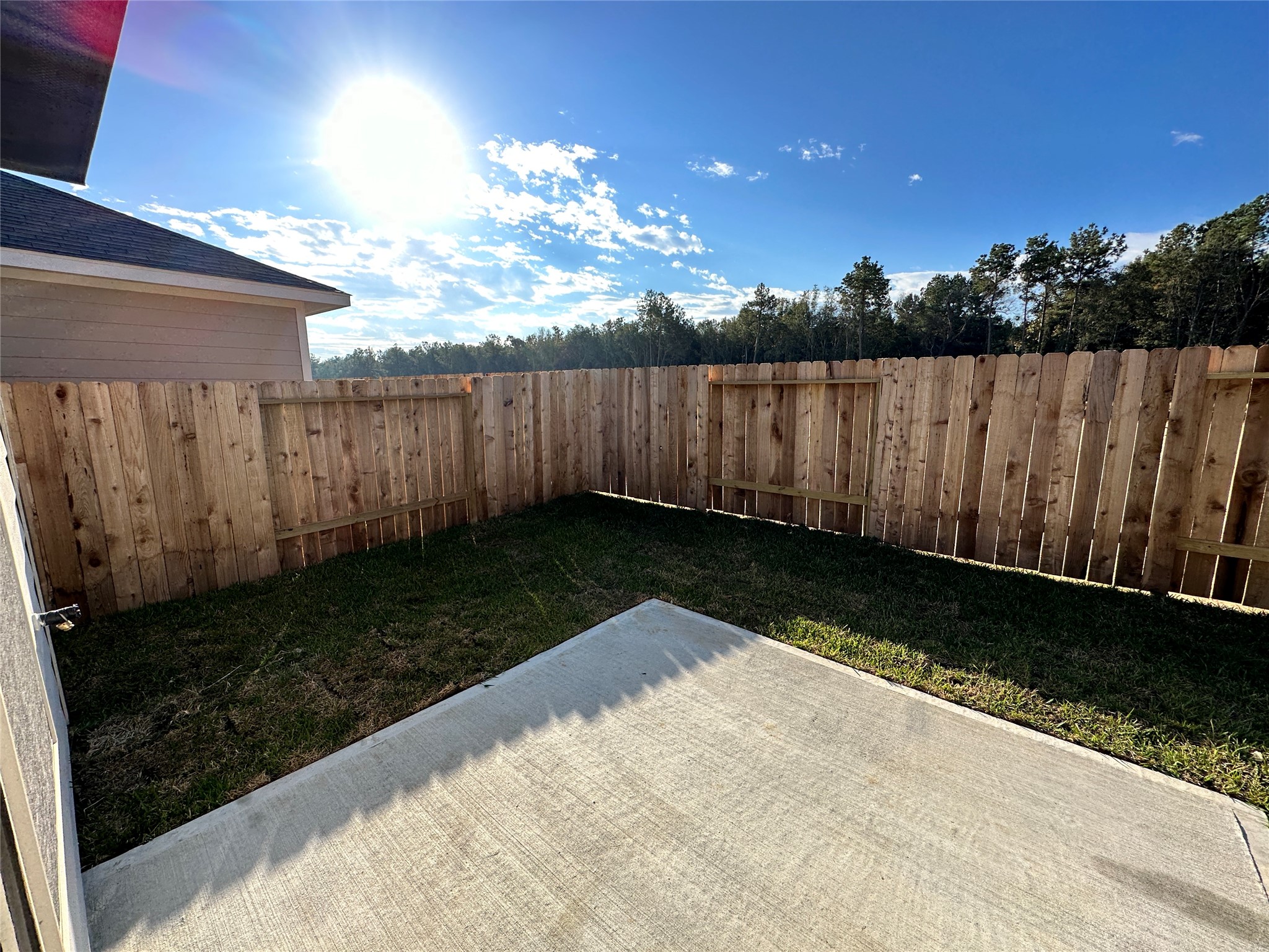16504 Moss Lane Porter, TX 77365 - Photo 16 of 16 a view of a backyard with wooden fence