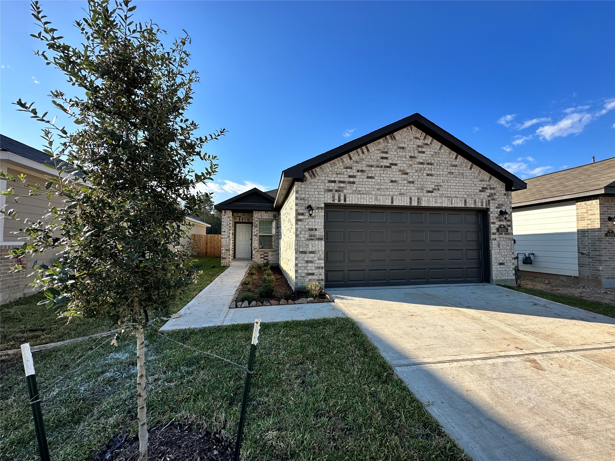 16504 Moss Lane Porter, TX 77365 - Photo 2 of 16 a front view of a house with garden