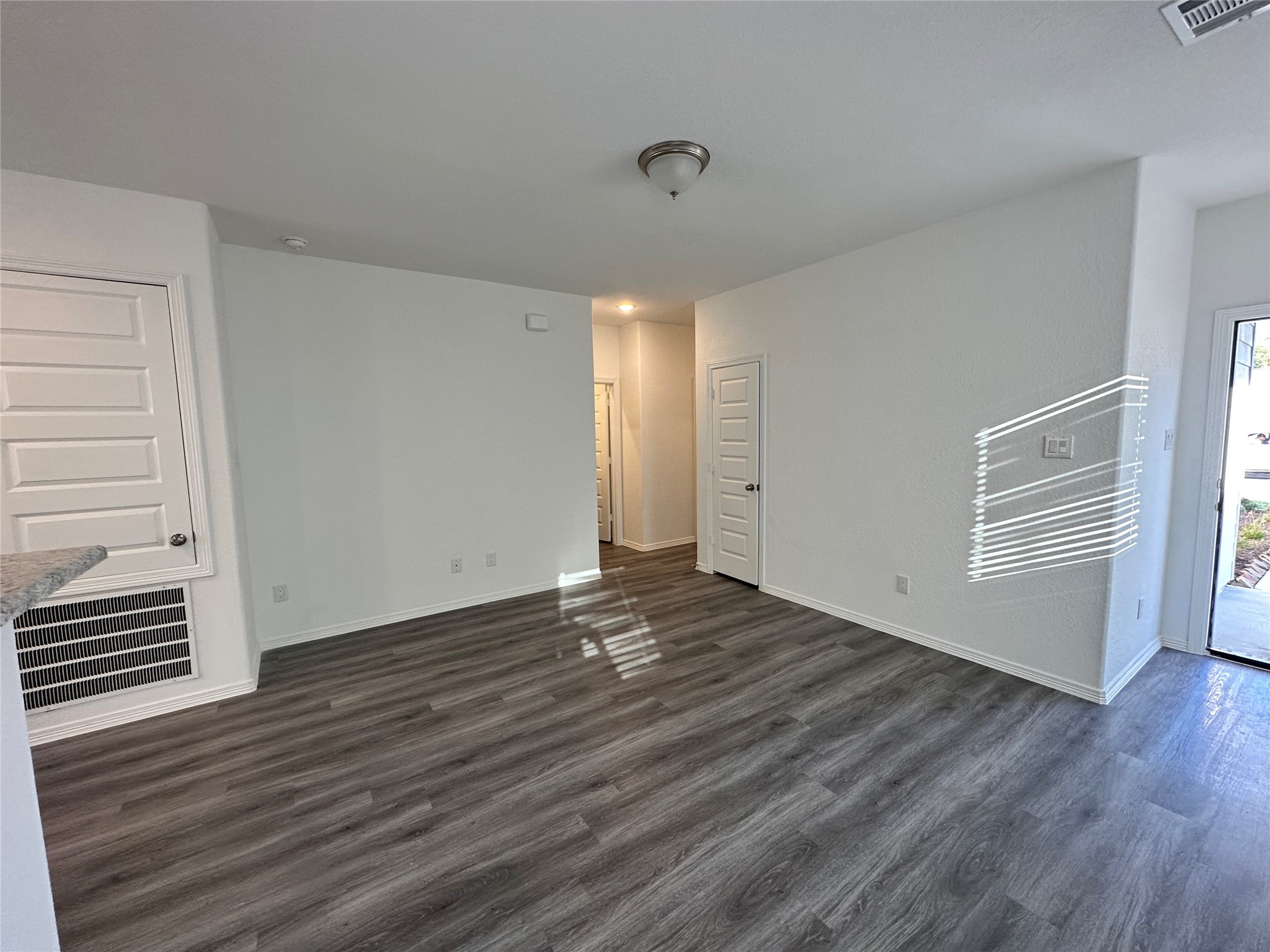 16504 Moss Lane Porter, TX 77365 - Photo 4 of 16 a view of an empty room with wooden floor and a window
