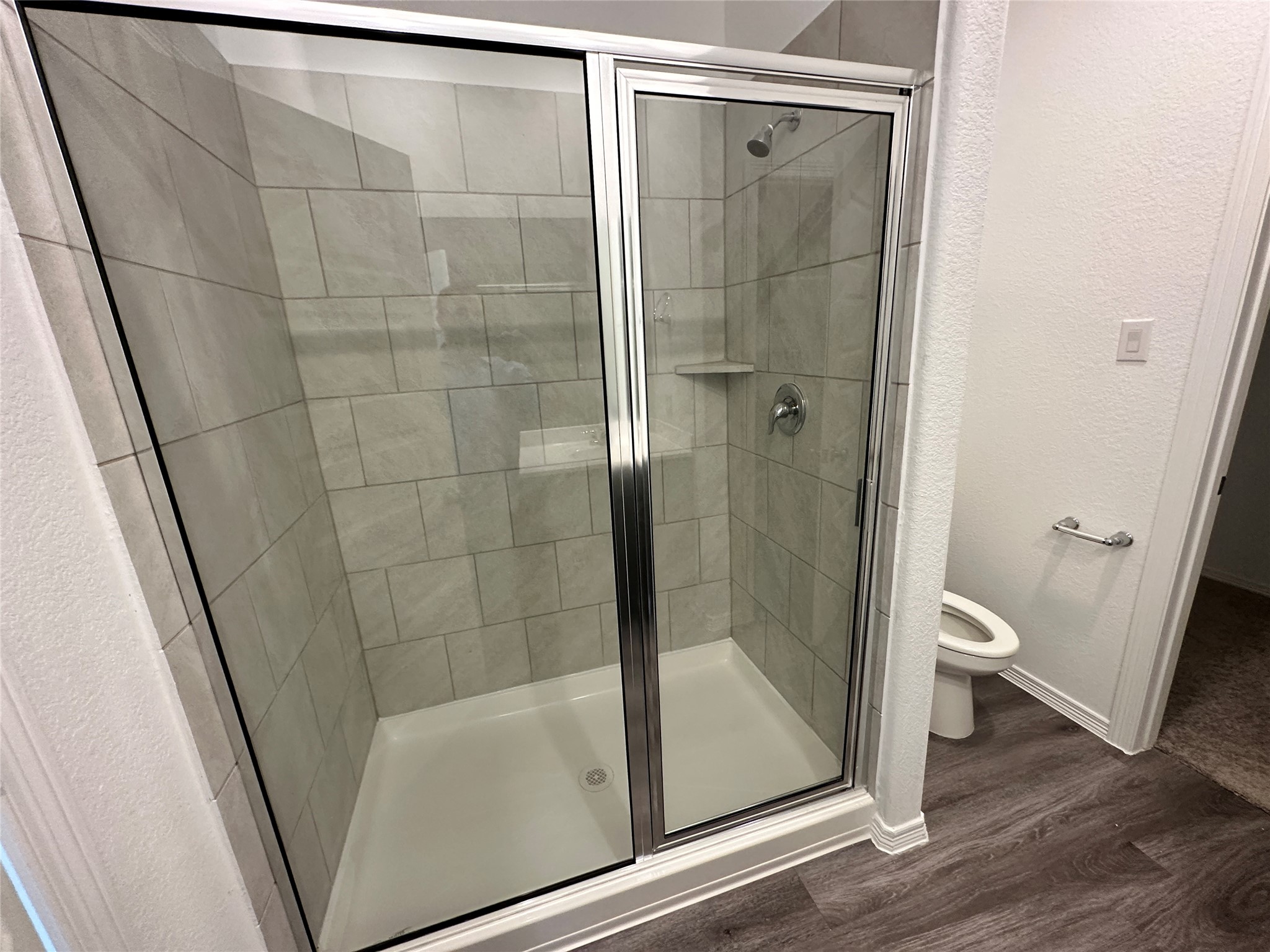 16504 Moss Lane Porter, TX 77365 - Photo 10 of 16 a bathroom with a glass door shower