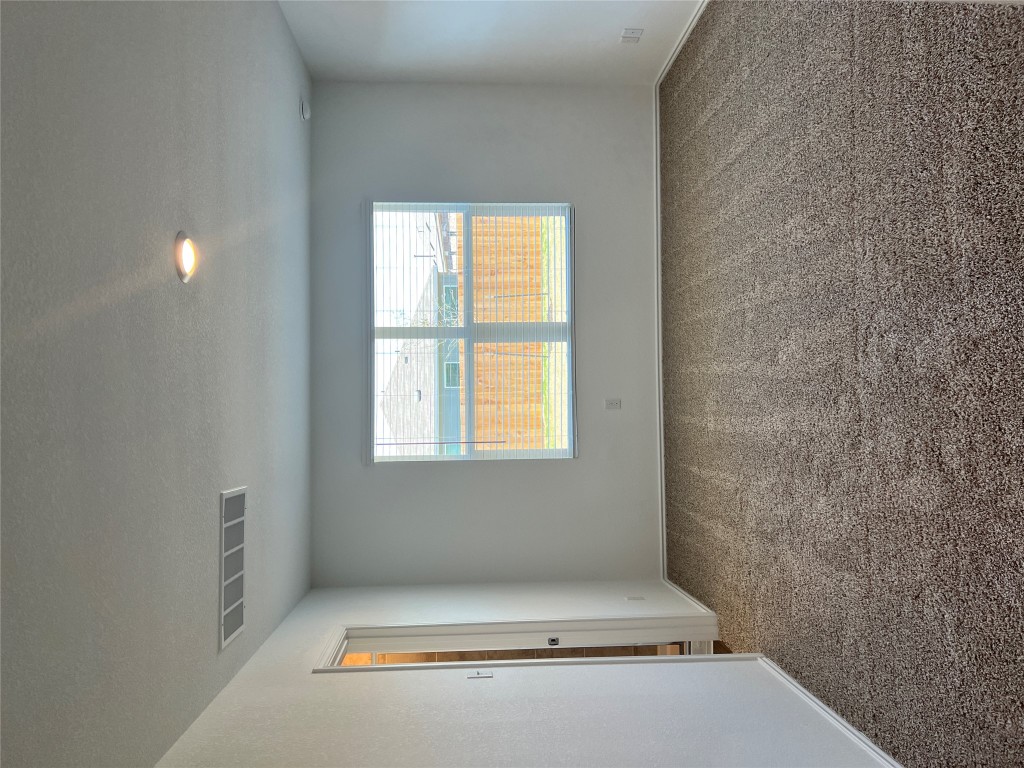 115 Canley Loop Hutto, TX 78634 - Photo 6 of 18 Unfurnished room with carpet and baseboards