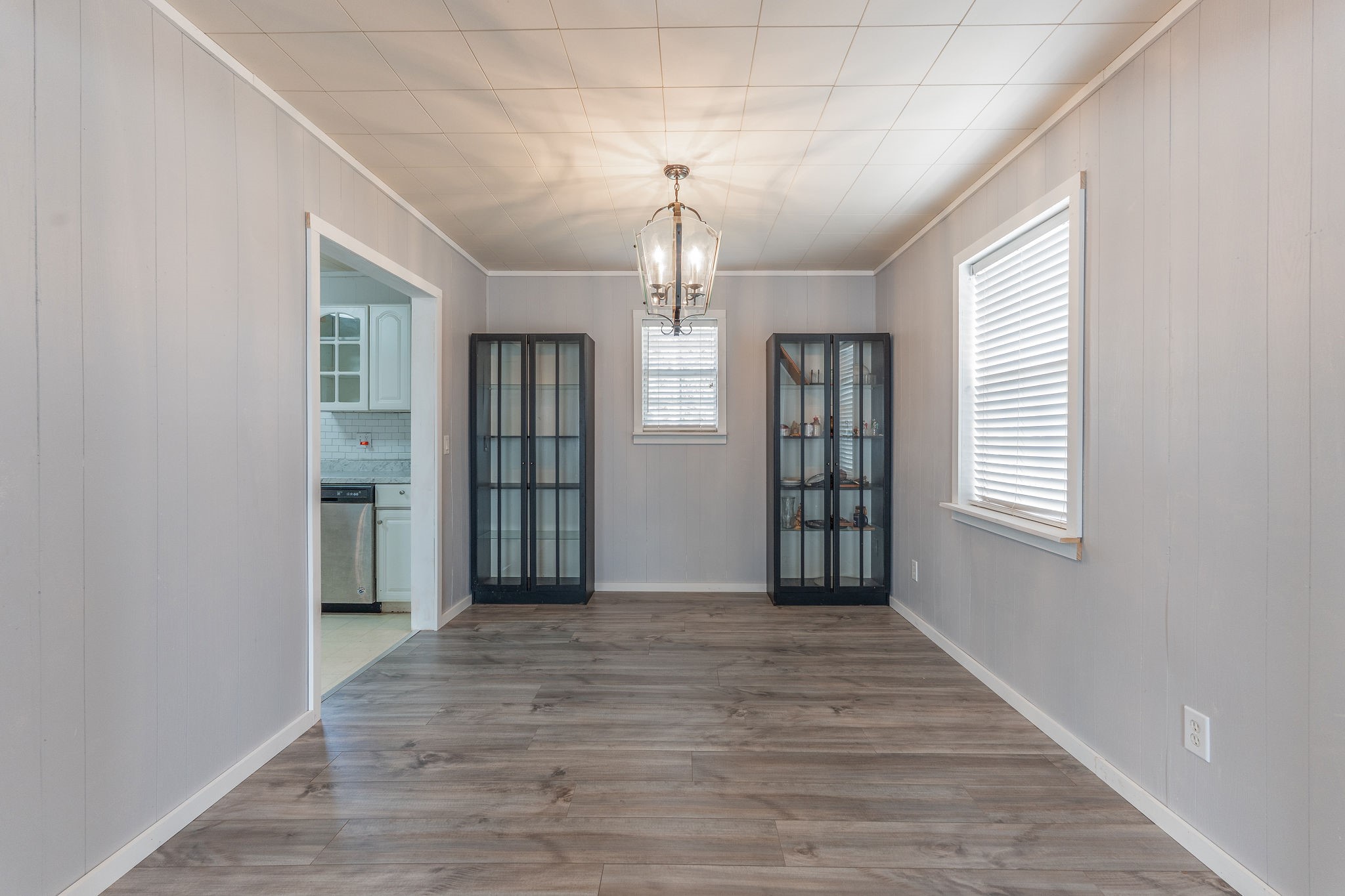 1310 Brazos Street Hempstead, TX 77445 - Photo 11 of 43 a view of an empty room with window and wooden floor