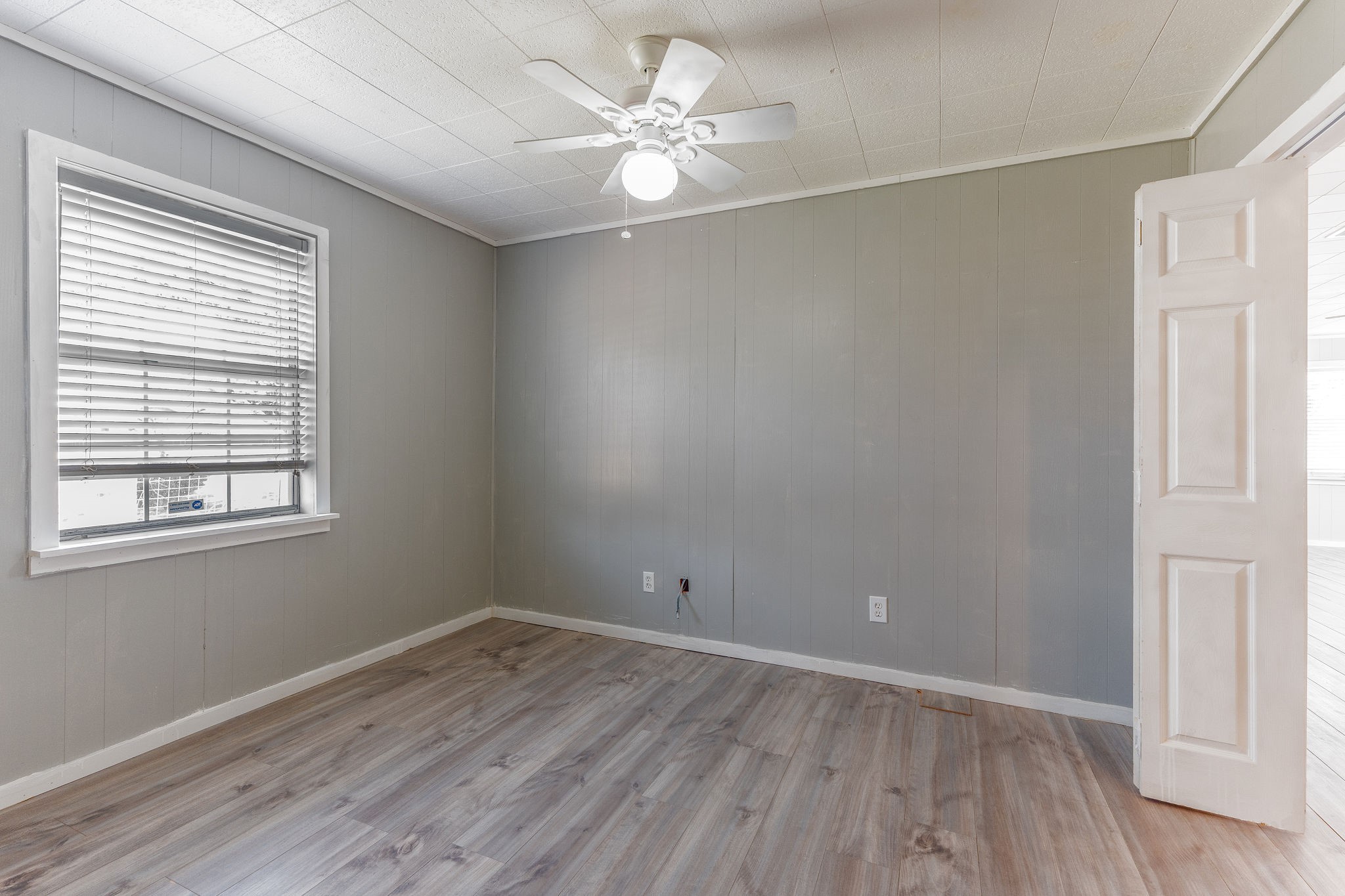 1310 Brazos Street Hempstead, TX 77445 - Photo 16 of 43 wooden floor in an empty room with a window
