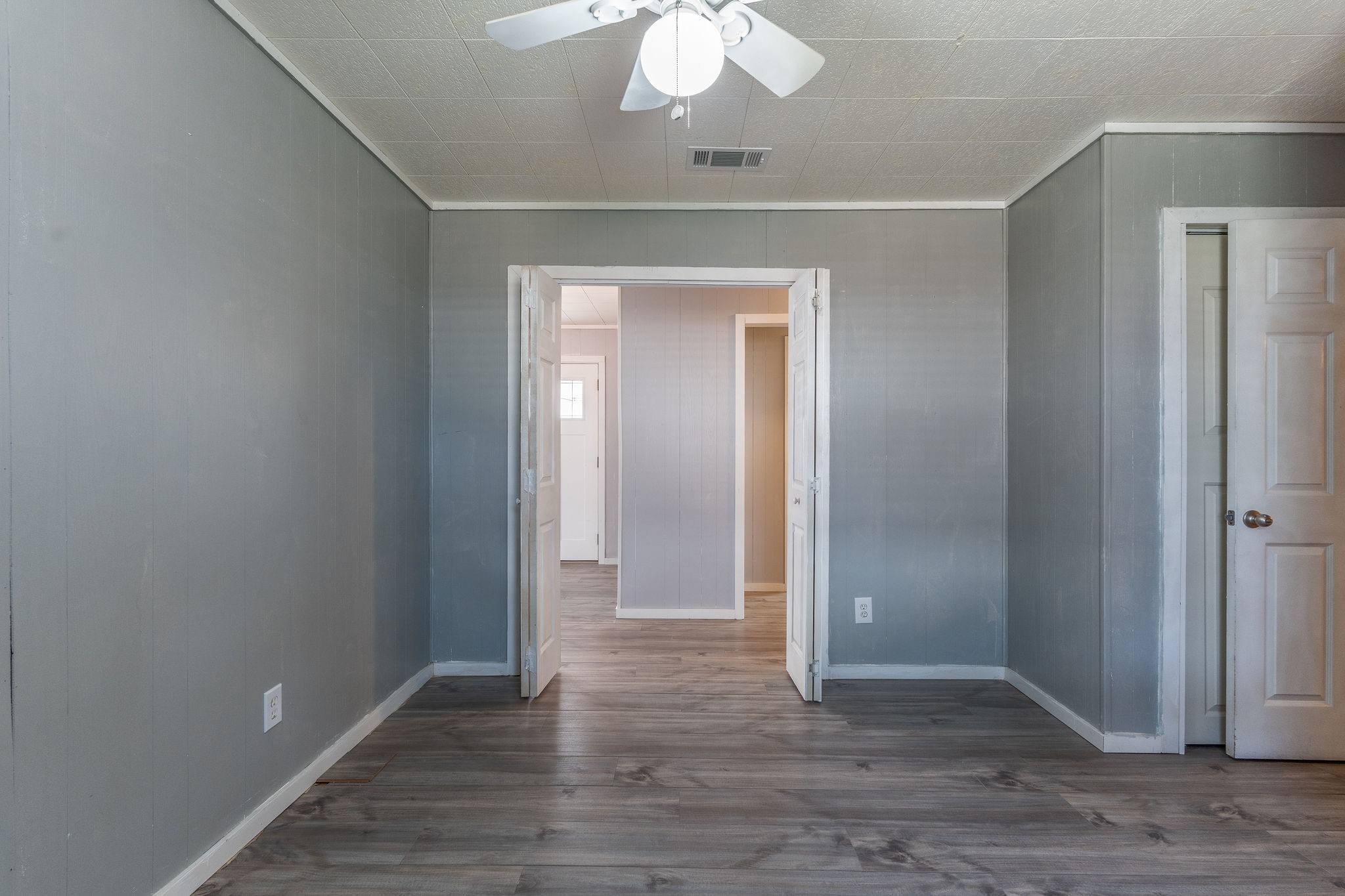 1310 Brazos Street Hempstead, TX 77445 - Photo 17 of 43 a view of an empty room with wooden floor
