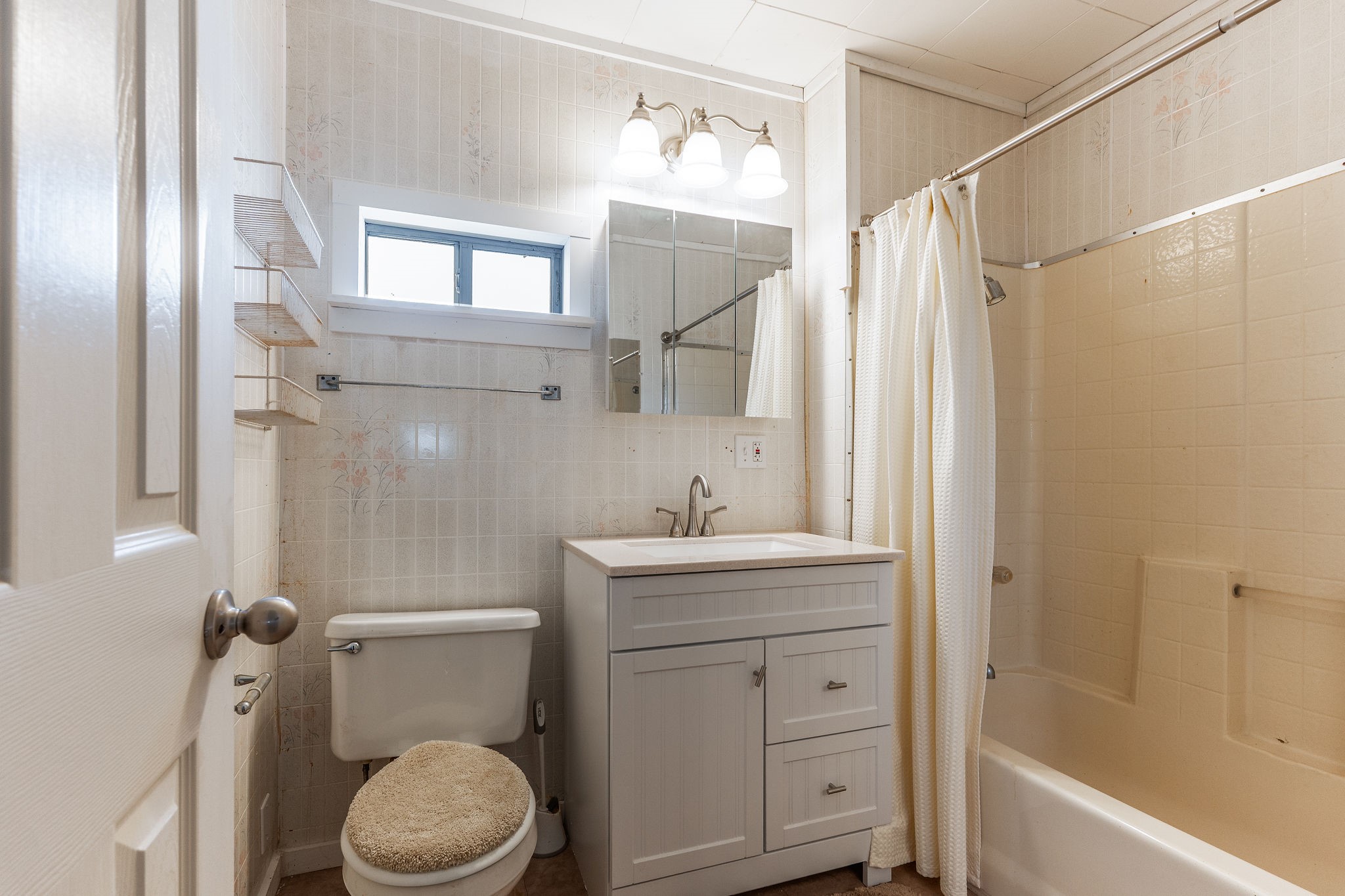 1310 Brazos Street Hempstead, TX 77445 - Photo 19 of 43 a bathroom with a sink a toilet and shower