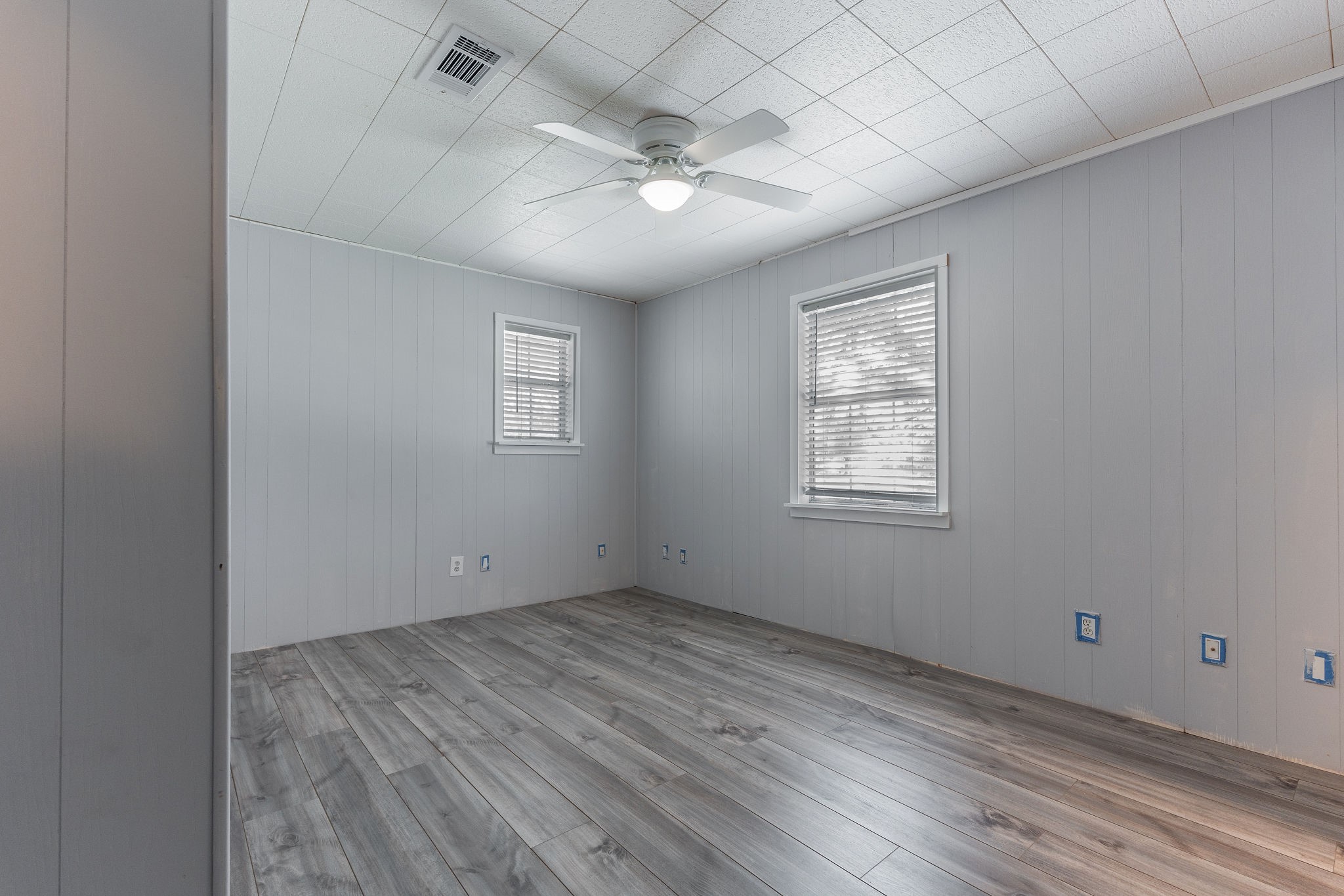 1310 Brazos Street Hempstead, TX 77445 - Photo 21 of 43 an empty room with wooden floor and windows