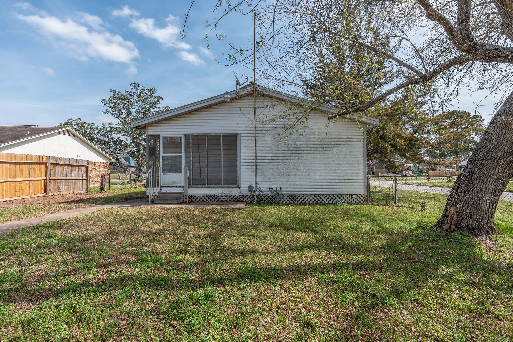 1310 Brazos Street Hempstead, TX 77445 - Photo 26 of 43 a house with trees in front of it