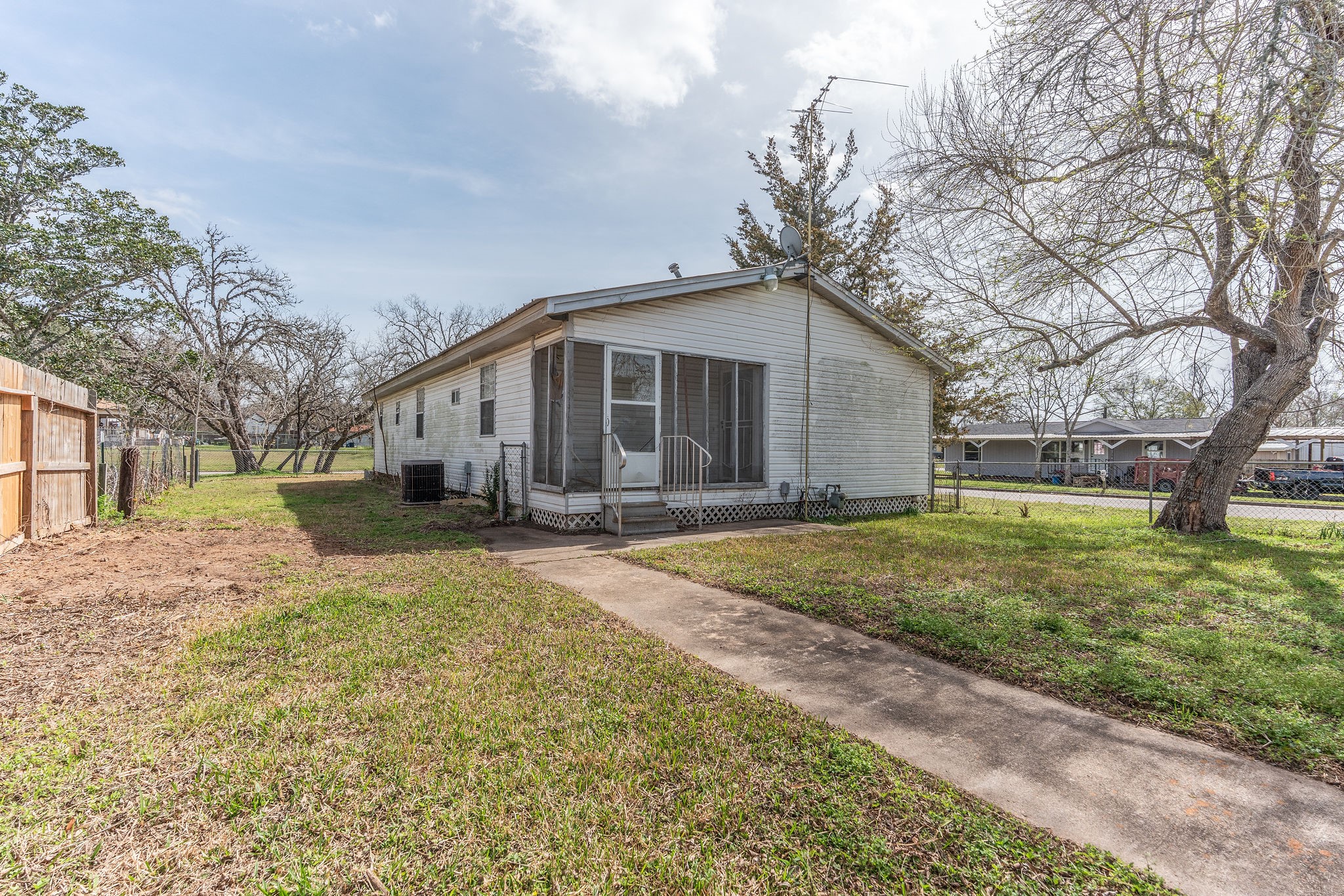 1310 Brazos Street Hempstead, TX 77445 - Photo 27 of 43 a front view of a house with a yard