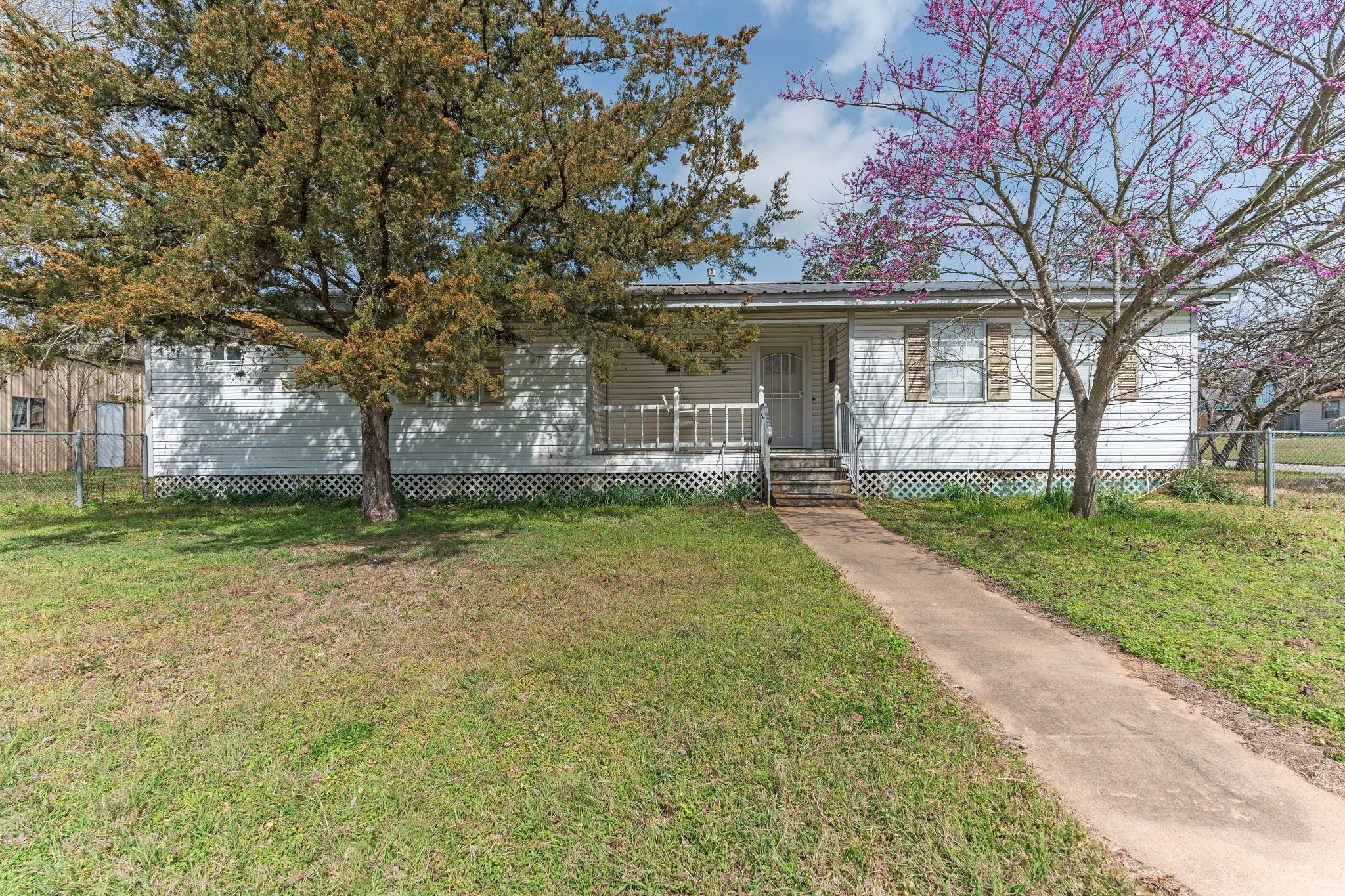 1310 Brazos Street Hempstead, TX 77445 - Photo 28 of 43 front view of a house with a yard