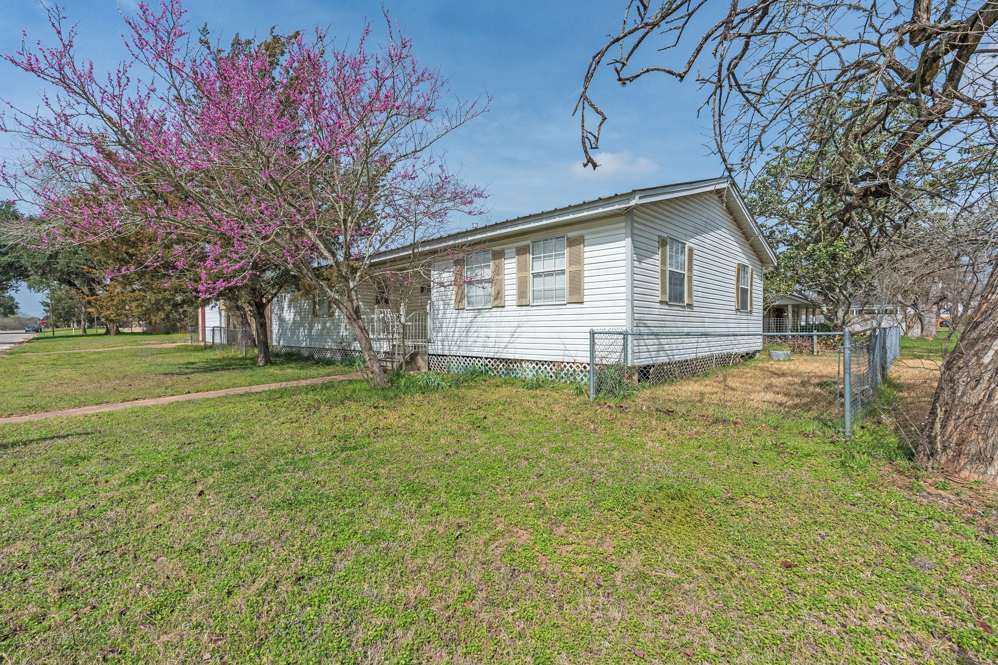 1310 Brazos Street Hempstead, TX 77445 - Photo 3 of 43 a view of a house with a yard