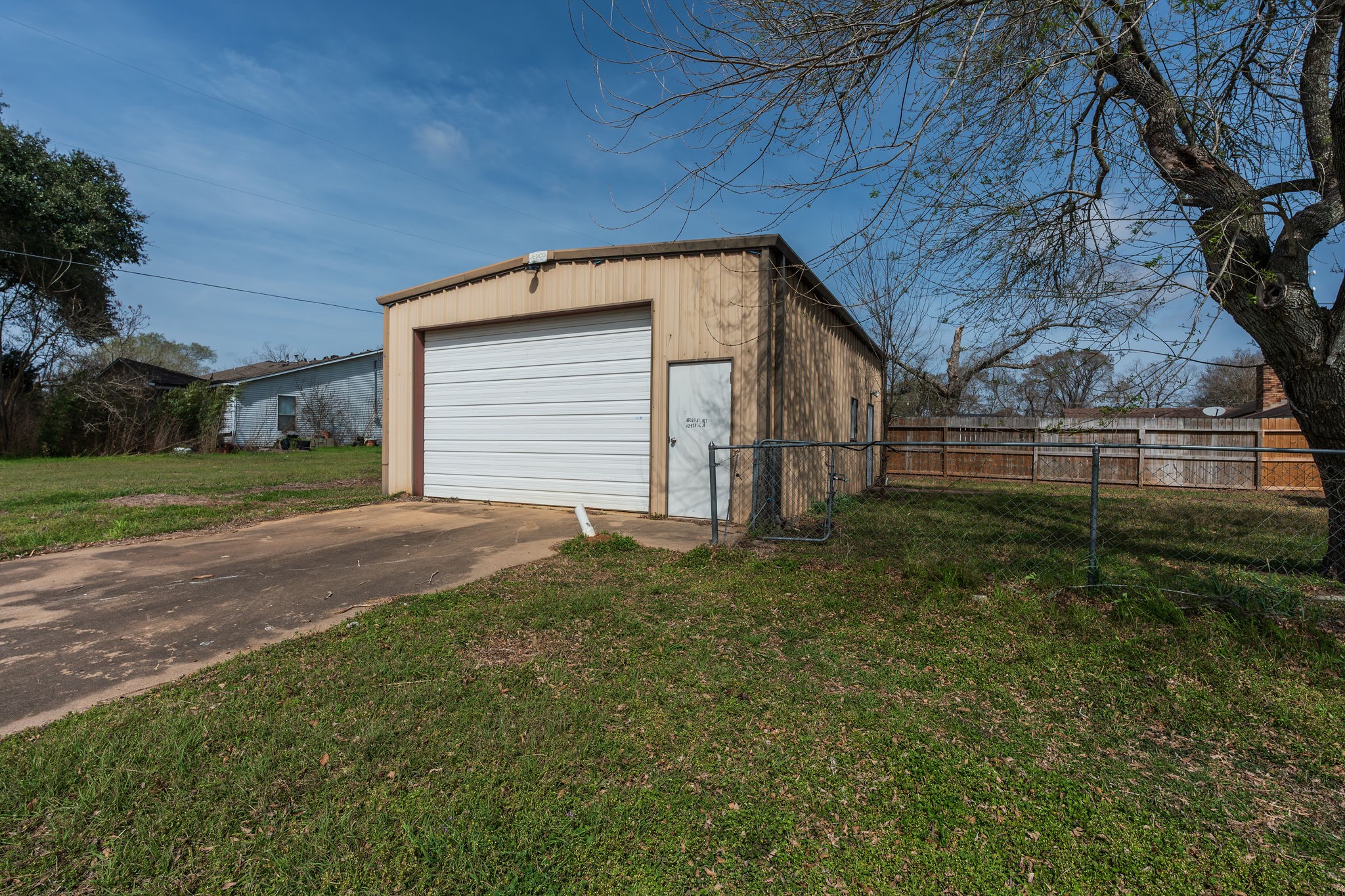 1310 Brazos Street Hempstead, TX 77445 - Photo 32 of 43 a view of backyard and garage
