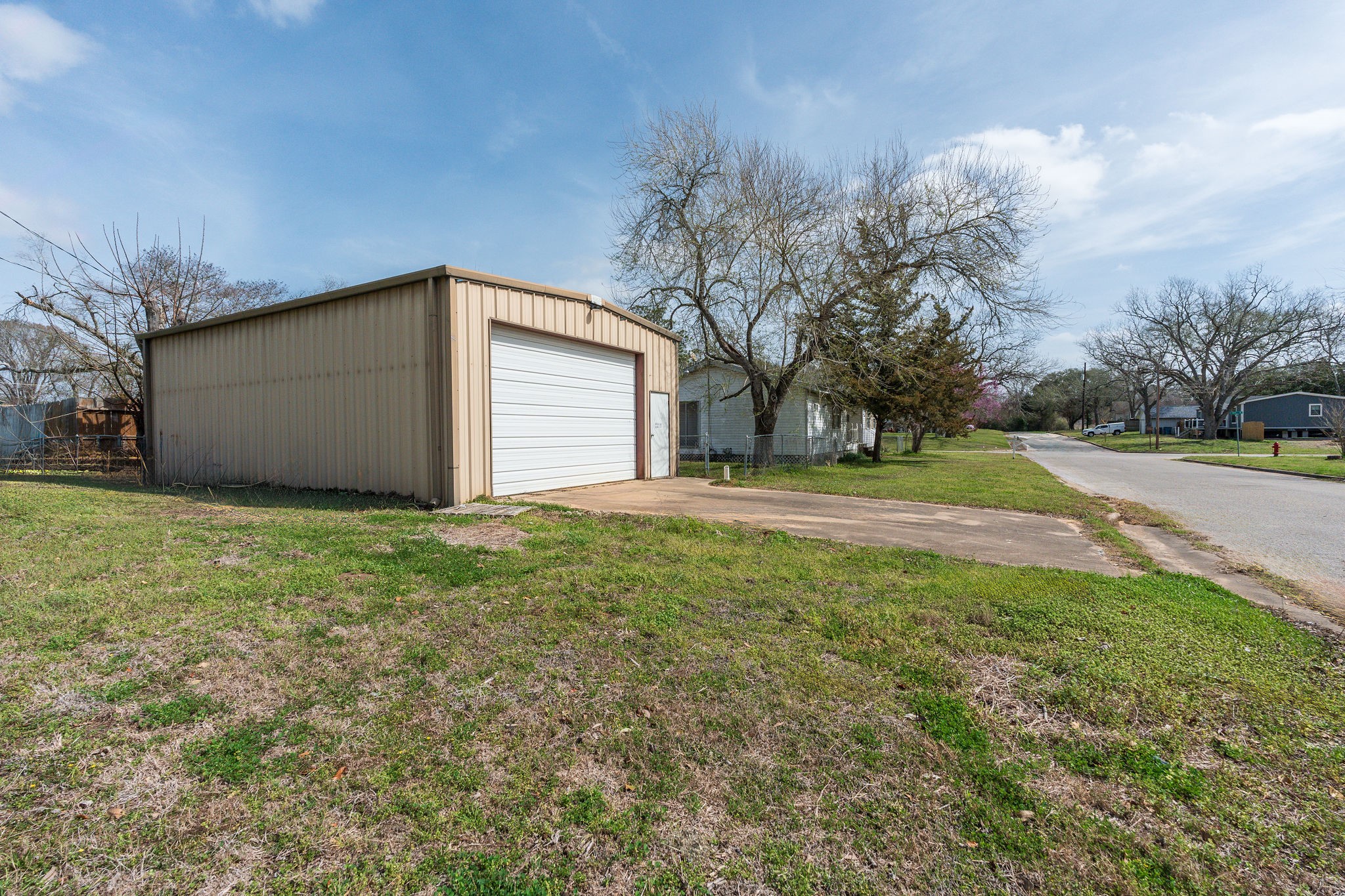 1310 Brazos Street Hempstead, TX 77445 - Photo 33 of 43 a front view of house with yard and trees