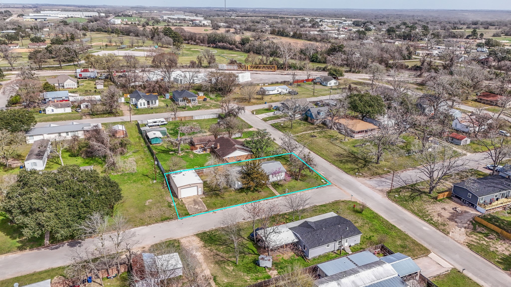 1310 Brazos Street Hempstead, TX 77445 - Photo 38 of 43 an aerial view of residential houses with outdoor space