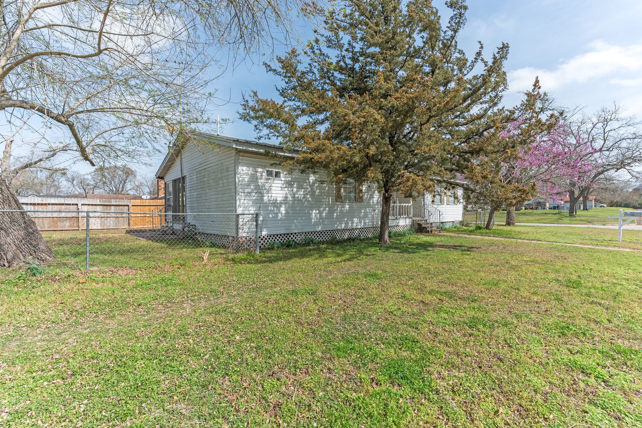1310 Brazos Street Hempstead, TX 77445 - Photo 4 of 43 a view of a house with a yard