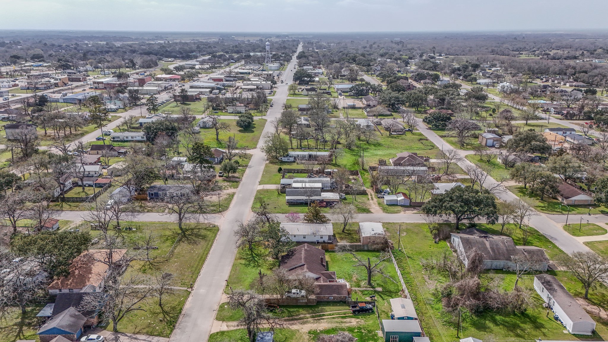 1310 Brazos Street Hempstead, TX 77445 - Photo 42 of 43 an aerial view of residential houses with outdoor space