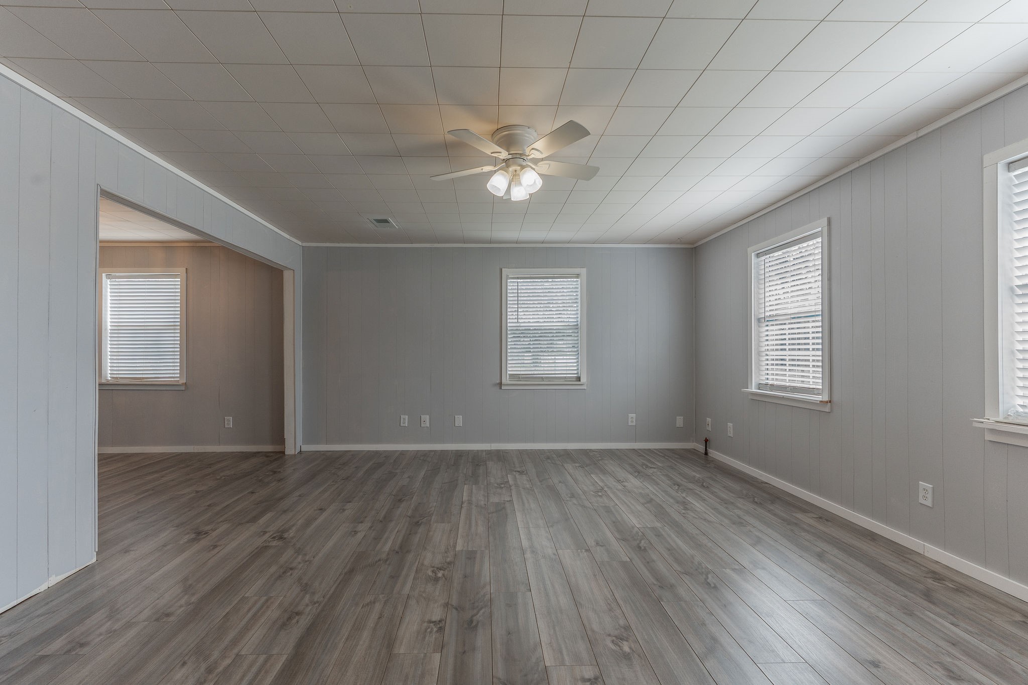 1310 Brazos Street Hempstead, TX 77445 - Photo 9 of 43 a view of an empty room with wooden floor and a window