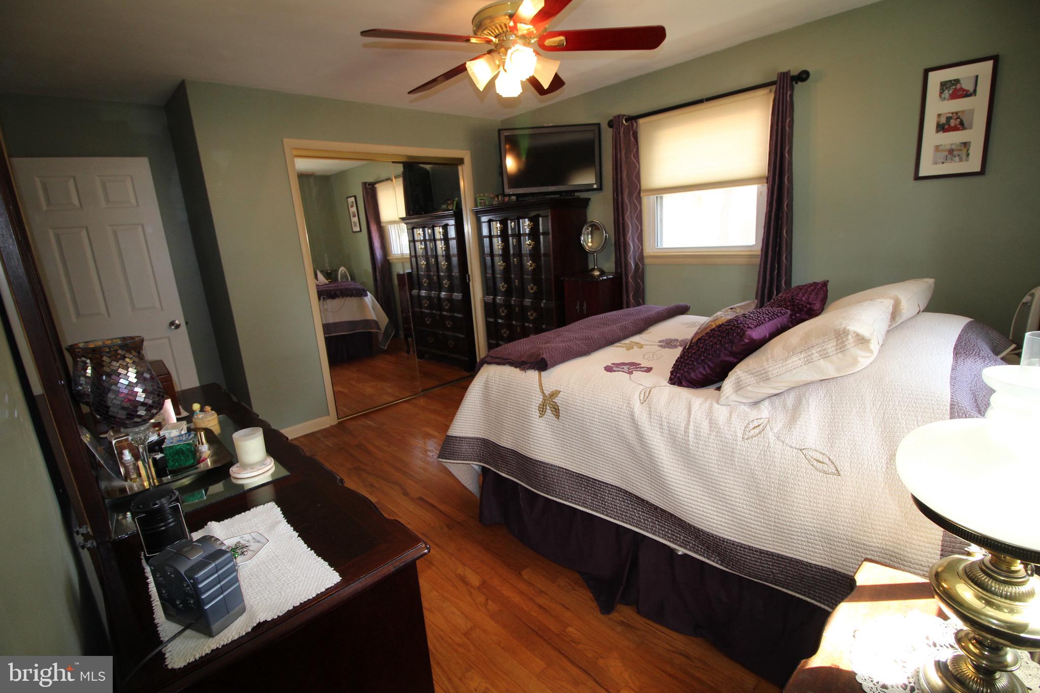 112 Harvard Road Glassboro, NJ 08028 - Photo 13 of 24 a bedroom with bed window and couch
