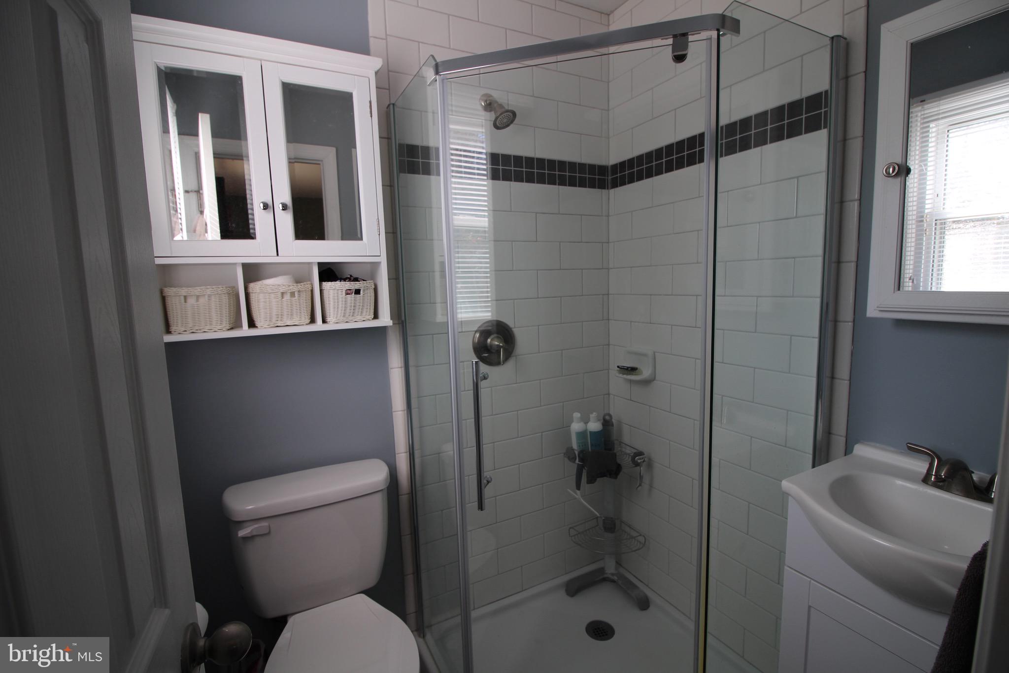 112 Harvard Road Glassboro, NJ 08028 - Photo 14 of 24 a bathroom with a toilet and a shower