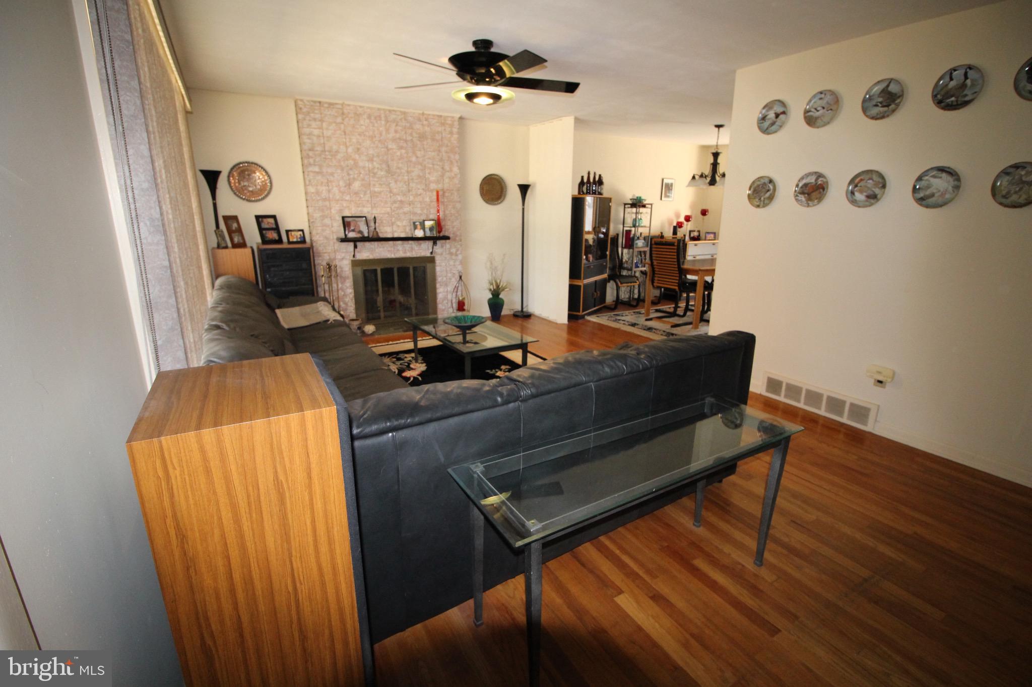 112 Harvard Road Glassboro, NJ 08028 - Photo 10 of 24 a living room with furniture and wooden floor