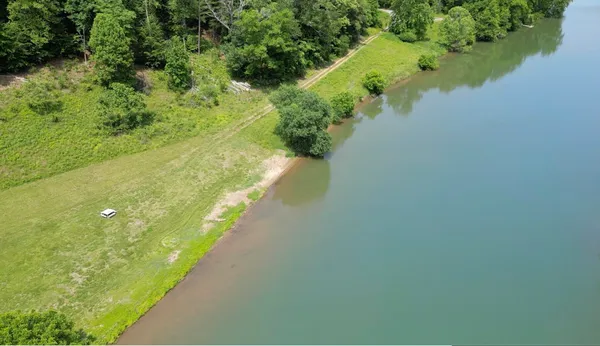 a view of a lake with a yard