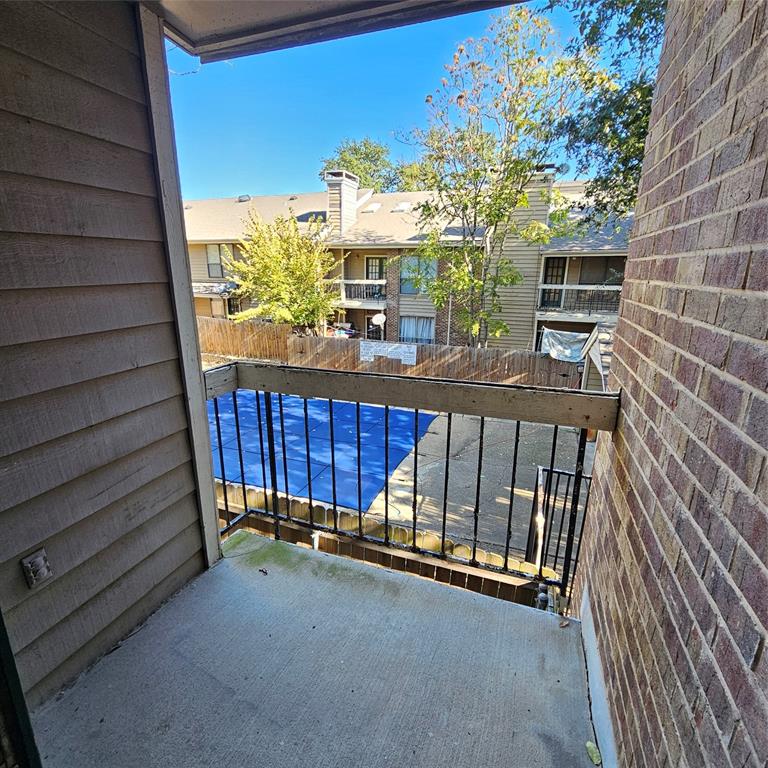 5750 Phoenix Drive, Unit 15 Dallas, TX 75231 - Photo 15 of 23 a view of a balcony with chairs