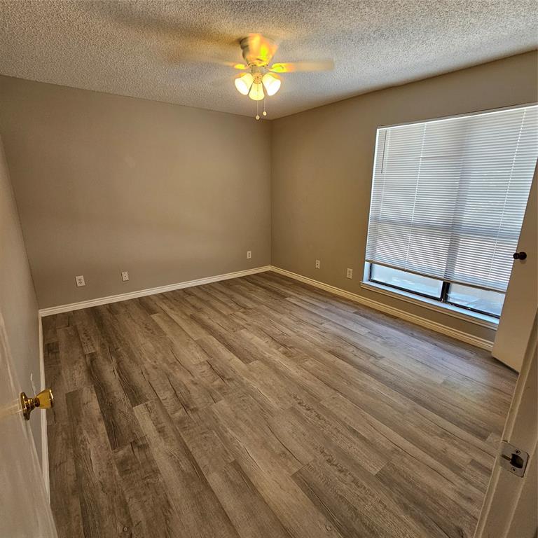 5750 Phoenix Drive, Unit 15 Dallas, TX 75231 - Photo 22 of 23 a view of an empty room with a window