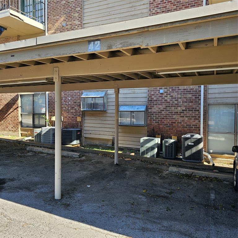 5750 Phoenix Drive, Unit 15 Dallas, TX 75231 - Photo 23 of 23 a view of a brick house with outdoor space