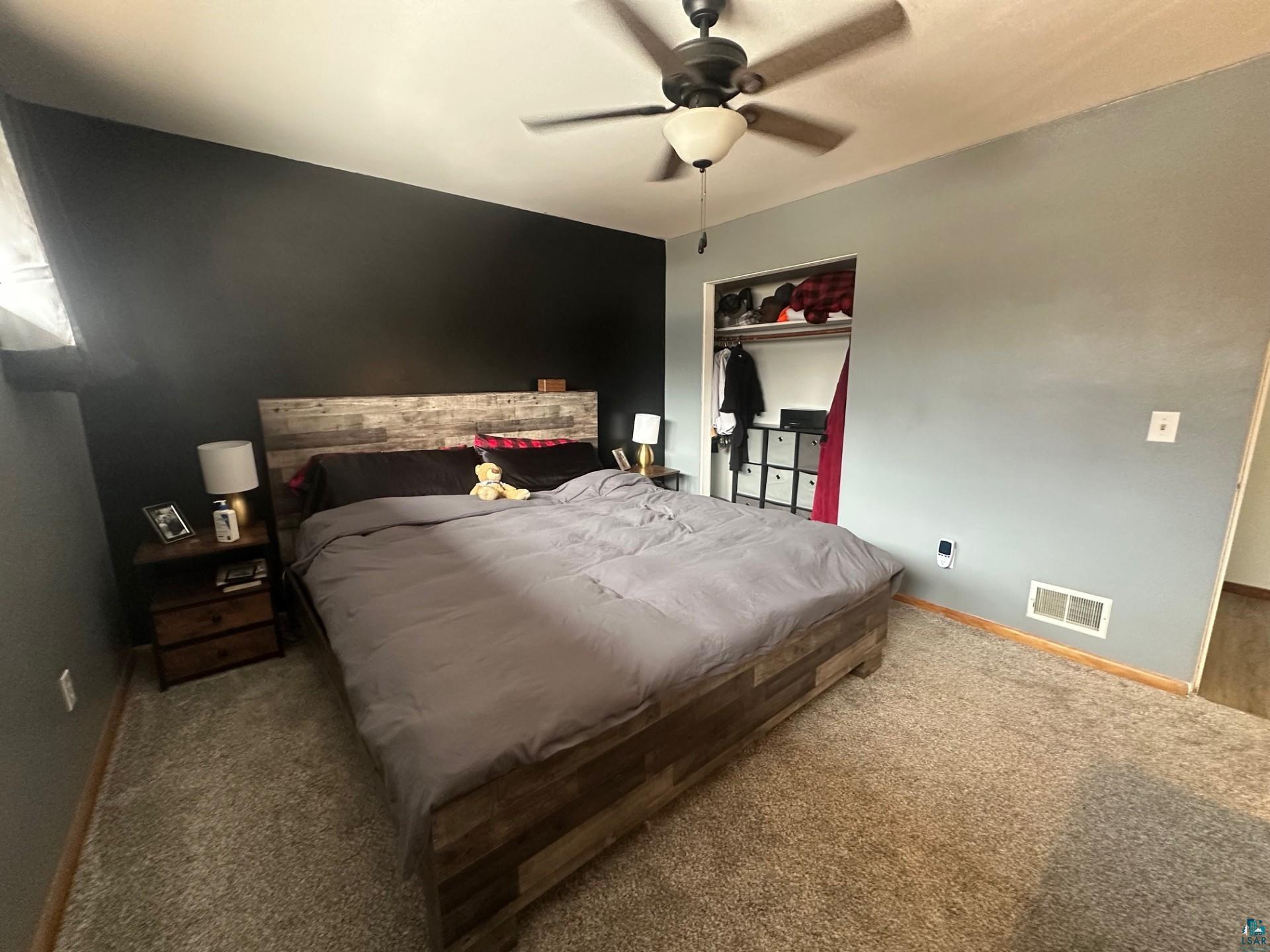 702 27th Street Cloquet, MN 55720 - Photo 8 of 25 Carpeted bedroom featuring a closet and ceiling fan