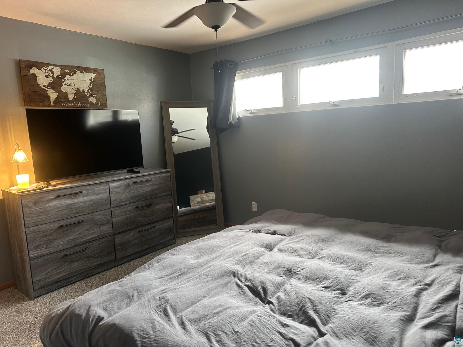 702 27th Street Cloquet, MN 55720 - Photo 9 of 25 Carpeted bedroom featuring a ceiling fan
