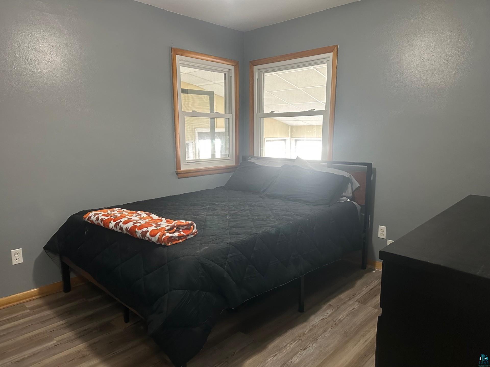 702 27th Street Cloquet, MN 55720 - Photo 10 of 25 Bedroom with light wood-type flooring and baseboards