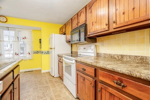 a kitchen with stainless steel appliances granite countertop a sink and cabinets