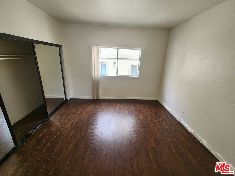 4328 Whitsett Avenue, Unit 4 Studio City, CA 91604 - Photo 12 of 73 an empty room with wooden floor and windows