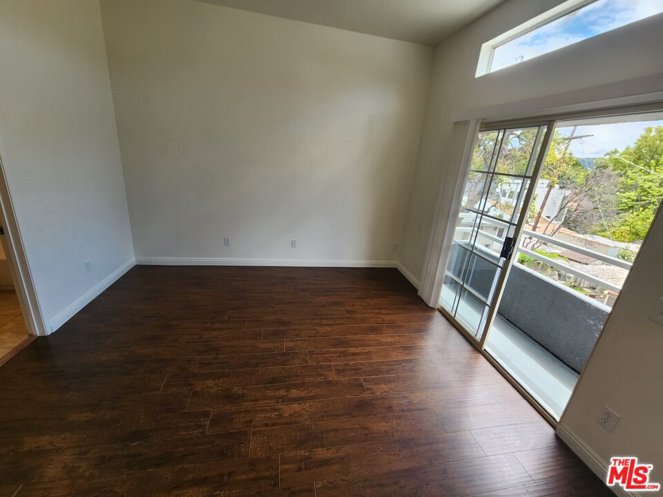 4328 Whitsett Avenue, Unit 4 Studio City, CA 91604 - Photo 25 of 73 a view of an empty room with wooden floor and a window