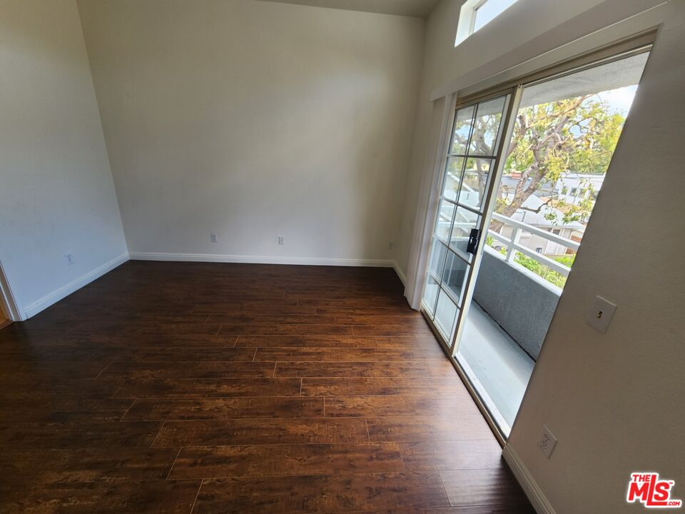 4328 Whitsett Avenue, Unit 4 Studio City, CA 91604 - Photo 26 of 73 a view of an empty room with wooden floor and a window