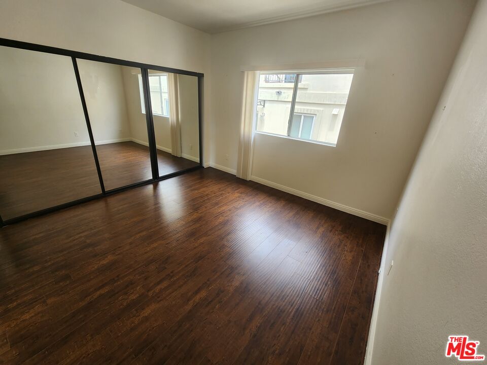 4328 Whitsett Avenue, Unit 4 Studio City, CA 91604 - Photo 3 of 73 a view of an empty room with wooden floor and a window