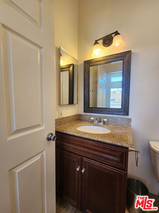 4328 Whitsett Avenue, Unit 4 Studio City, CA 91604 - Photo 37 of 73 a bathroom with a granite countertop sink and a mirror
